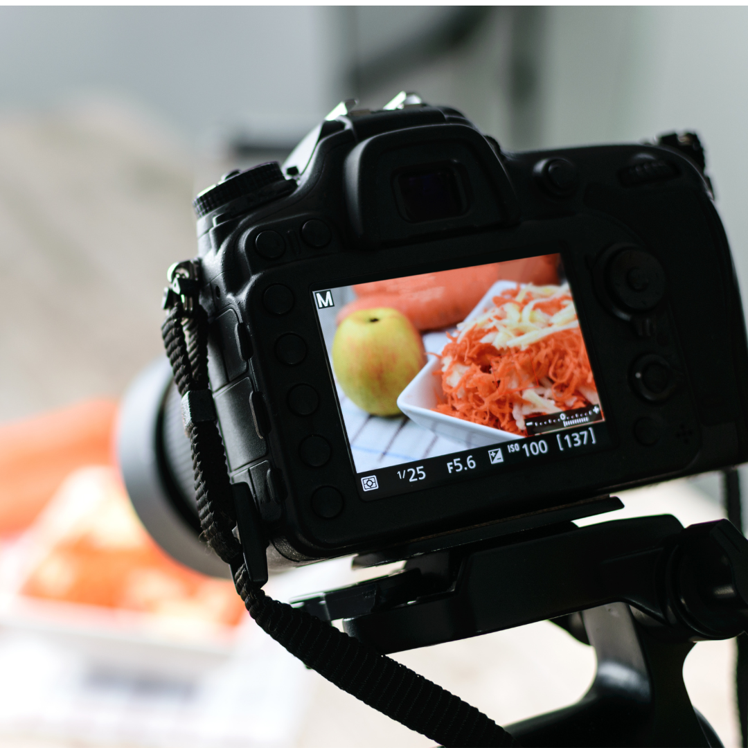 Image shows the back of a digital camera set up on a tripod to take a photo of some ingredients